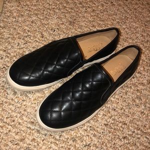 Black slip on patterned shoes